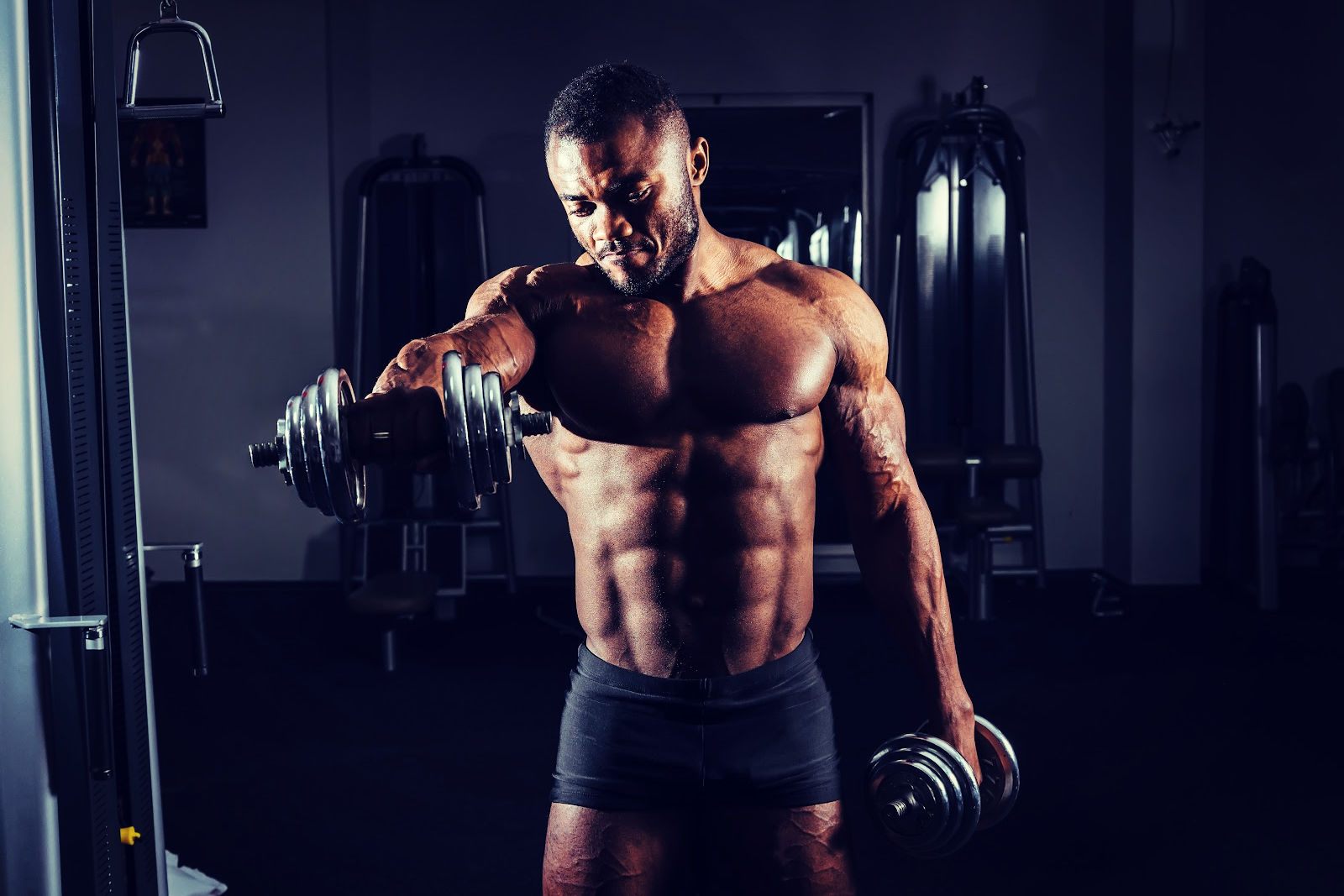 Muscular man with dumbbells