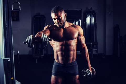 Muscular man with dumbbells