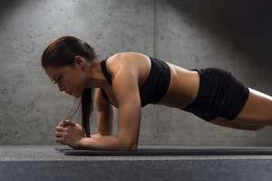 Home Workouts - woman doing core exercise