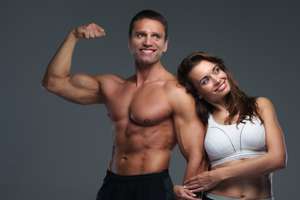 muscular man with woman training physique