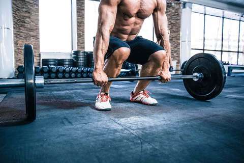Man performing deadlifts.