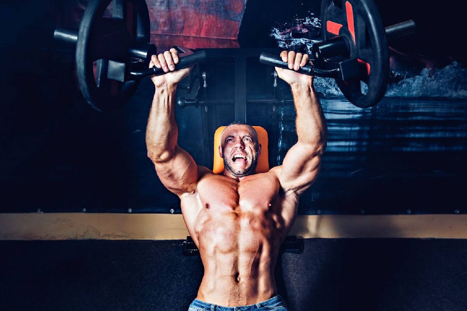Man working out with chest machine presses